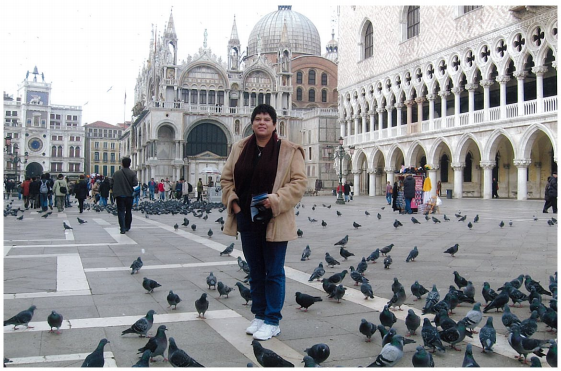 Claudia visiting one of her most favorite places on Earth, Venice Italy in November. She say’s it’s always very cold in November, but it’s also very quiet and peaceful then too.