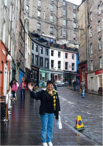 Claudia in Edinburgh Scotland 2010. She was there for Firewalk Training and also attended the Worlds largest festival “The FRINGE”. It was crowded, so she got up really early and went for a quiet walk on the streets before everyone else woke up. Claudia loves Edinburgh and attended the Military Tattoo while there.